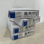 Omron NX-OD4121 8-point NPN output unit — front view showing the slim 12 mm wide body with 8 yellow output status LEDs across the front face and the screwless push-in 16-terminal connector on the bottom