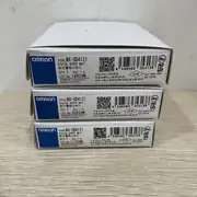 Omron NX-OD4121 8-point NPN output unit — top view showing the TS (terminal status) and PWR (power OK) indicators and the NX-Bus connector on the left side for daisy-chaining NX I/O units
