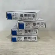 Omron NX-OD4121 8-point NPN output unit — right-side label close-up showing the model number NX-OD4121 and the 8-point NPN / 0.5 A per point designation