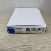 Omron NX-OD4121 8-point NPN output unit — installed on an NX-ECC202 EtherCAT coupler alongside 4 × NX-ID4142 input units and 2 × NX-OD4256 output units, with 24 VDC load wiring from 8 pneumatic valve solenoids on the output connector