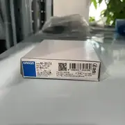 Omron NX-OD5256 16-point PNP sourcing digital output unit — front view showing the 16-position screwless push-in terminal block with the 16 orange LED output indicators above, and the TS (Trouble Status) LED