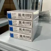 Omron NX-OD5256 NX-series 16-pt PNP output unit — side view showing the slide-rail mounting interface to NX-ECC EtherCAT coupler and the 12 mm slim form factor