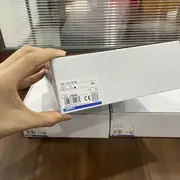 P7SA-10F-ND shipping box held in hand showing the TYPE P7SA-10F-ND SOCKET / VOLTS DC 24V / QTY 10 / LOT label, the barcode, and the CE / KC certification marks on the front