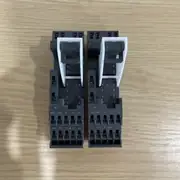 Omron P7SA-14F-ND-PU DC24 socket — bottom terminal view with white lock markers, Push-In Plus terminal openings, and numbered contact markings 11/12 through 63/64