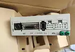 Omron R7D-BP02HH-Z — front face of the SmartStep 2 drive with OMRON wordmark, mini-DIN encoder CN1, DB-15 I/O CN2, mini-USB CN3, and the CN3A / CN3B / CN4 white terminal blocks plus green PE ground screw, sitting on its cardboard tray