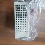 Omron R7D-BP02HH-Z — top view of the drive showing the heat-sink ventilation grid through the anti-static bag