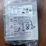 Omron R7D-BP02HH-Z — side nameplate label of the drive wrapped in plastic, listing INPUT 200-240 V 1-phase 1.9 A 50/60 Hz, OUTPUT 92 V 3-phase 1.6 A 0-333.3 Hz, POWER 200 W, ENCODER 2500 P/r, with CE / cURus / TUV SUD marks and DANGER / high-voltage / high-temperature warning boxes