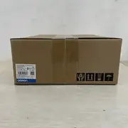 Omron R88D-1SN04H-ECT 1S-series servo drive — side view showing the side-mounted status LEDs and the cooling-fin section on the bottom 70% of the housing; this 400 W unit is convection-cooled (no fan)