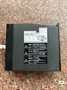 Omron 1S-series servo drive body (rear face) on a granite surface showing the OMRON wordmark / R88D-KN08H-ECT-Z AC SERVO DRIVER nameplate with INPUT 200-240 V 1 ph / 3 ph / 6.6 A / 3.6 A / 50/60 Hz / OUTPUT 0-240 V 3 ph / 4.1 A / 750 W / EtherCAT / CE / ULus LISTED 7Z45 IND.CONT.EQ. / TUV marks / SERIAL No. P11050049N / Ver. 2.0 / OMRON Corporation / MADE IN CHINA / DANGER high-voltage / Hazardous Voltage / High Temperature warning labels / heat-sink ventilation slots along the sides