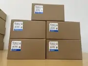 Omron R88D-KN04H-ECT-Z Accurax G5 servo drive — installed in a control cabinet on a 35 mm DIN rail next to an NJ501-1400 EtherCAT master, with the motor power cable to an R88M-K40030H-S2-Z servo motor and the EtherCAT daisy-chain cable to the next drive in the cabinet