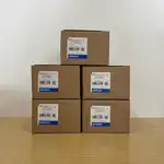 Omron R88M-K20030H-S2 servo motor — five cardboard shipping boxes stacked showing Omron labels TYPE R88M-K20030H-S2, AC SERVO MOTOR, QTY 1, MADE IN CHINA, lot 210521SN