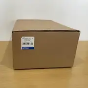 Omron R88M-K2K030H-S2-Z servo motor — another sealed cardboard shipping box with Omron label showing TYPE R88M-K2K030H-S2-Z, AC SERVO MOTOR, QTY 1, MADE IN CHINA, Lot 200912BSN