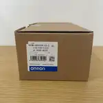 Omron R88M-K40030H-S2 — top label close-up showing the part number, the 400 W rating, the 3000 rpm speed, and the 200 V rating on the motor nameplate