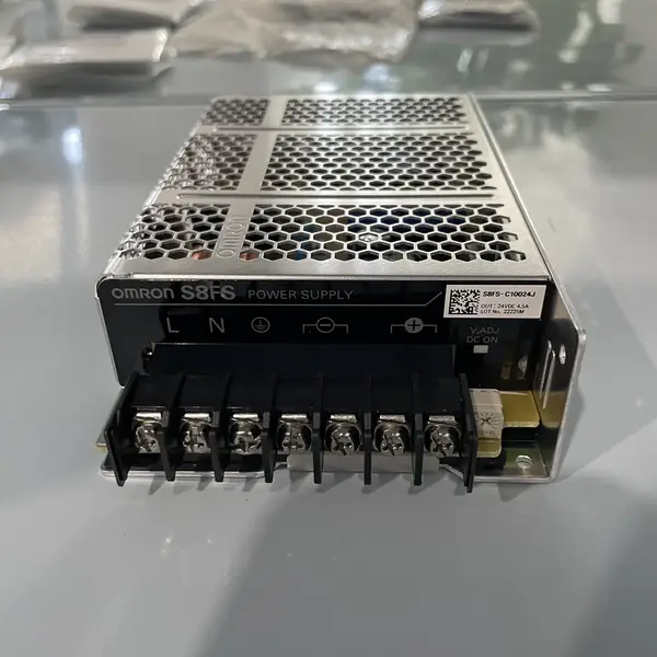 Omron S8FS-C10024J — front face of the enclosed aluminium housing showing the brand label, the 24 VDC output rating, and the DC OK green LED
