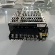 Omron S8FS-C10024J — front face of the enclosed aluminium housing showing the brand label, the 24 VDC output rating, and the DC OK green LED