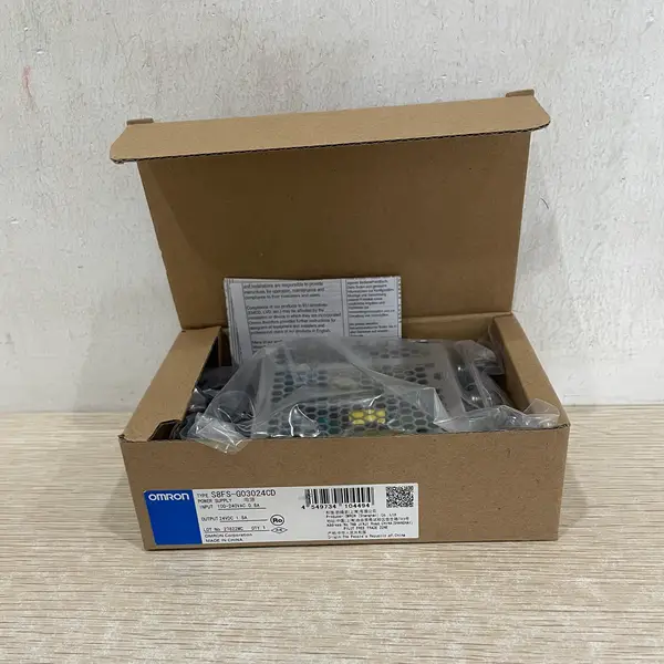 Omron S8FS-G03024CD — open carton showing the bagged supply, instructions, and model label