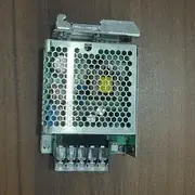 Omron S8FS-G03024CD — honeycomb cover, five screw terminals, and metal DIN-rail clip visible