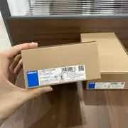 Omron S8FS-G15024CD — carton held with model and 6.5 A output label visible