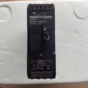 Omron S8VK-C06024 power supply - side view showing the 35 mm DIN-rail mounting clip on the rear and the ventilation slots on the top and bottom of the housing.