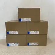 Omron S8VK-C24024 — five sealed cartons stacked with model labels facing forward
