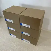 Omron S8VK-C24024 — six labeled cartons arranged in two angled stacks