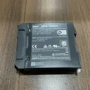 Omron S8VK-G06024 premium DIN-rail PSU - side view showing the 35 mm DIN-rail mounting clip and the 110 mm depth with finger-safe screw terminals