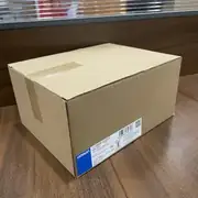 Omron S8VK-G12024 120 W DIN-rail power supply — side view showing the 35 mm DIN-rail mounting clip on the rear and the convection-cooling ventilation slots on the top and sides of the housing