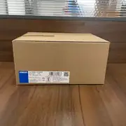 Omron S8VK-T12024 — sealed carton with the model and barcode label facing forward
