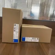 Omron S8VK-T12024 — two cartons showing front model and side barcode labels