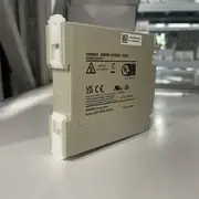 Omron S8VS-01505 — label panel and white DIN-rail mounting clips visible