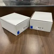 Omron S8VS-12024AP — two white cartons with Omron identification labels visible