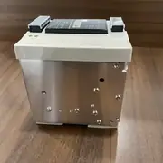Omron S8VS-24024A — metal housing side with covered terminal blocks and display panel along the top