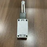 Omron WLCA12-TH-N — front view of the WL-N limit switch showing the die-cast aluminium body, the neon operation indicator, and the conduit entry on the side of the housing