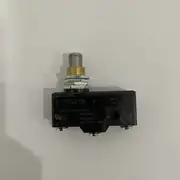 Omron Z-15GQ-B basic switch — side profile showing the compact rectangular body with the plunger extending from the front face and the screw terminals arranged on the rear