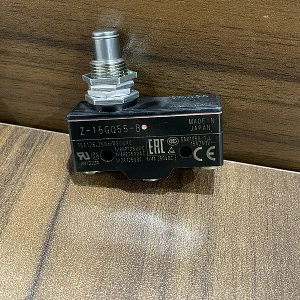 Omron Z-15GQ55-B basic switch — front face of the panel-mount body showing the threaded plunger barrel, the M3.5 screw terminals, and the Omron / Z-15G marking