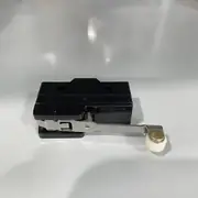 Omron Z-15GW2-B — side view of the black Z-15 basic switch with the OMRON wordmark embossed on the side, the long steel hinge lever with the white nylon roller at the end, the return spring visible on top, and two M4 mounting holes on the side on a white surface